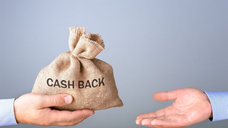 Two hands extended one is holding a burlap bag that says "cash back." While the other hand reaches for it. Meant to illustrate CPP disability retroactive payment.