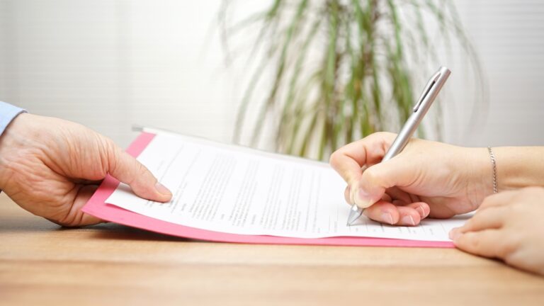 Person signing a severance agreement.